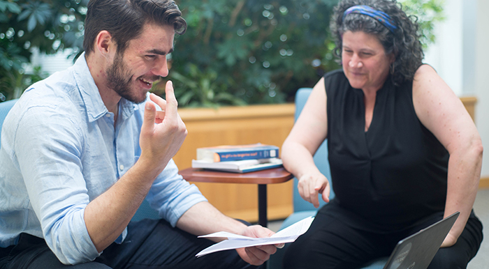 Student and faculty discussing research project