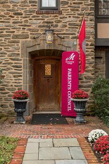 Doorway to building with sign reading Parents Council