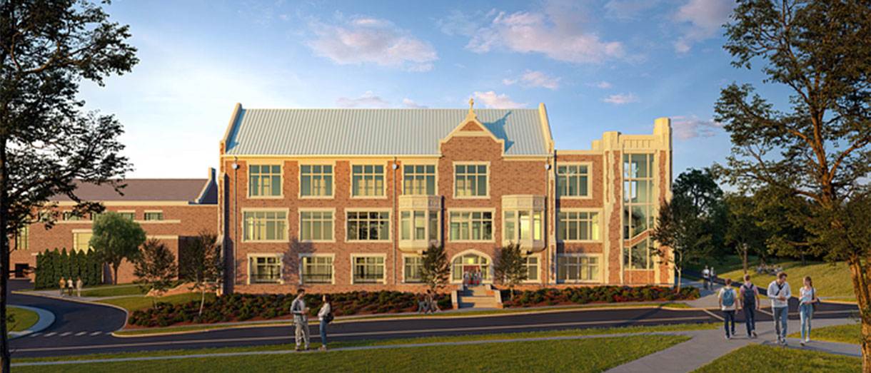 A large brick building with many windows and a brigth blue sky overhead.