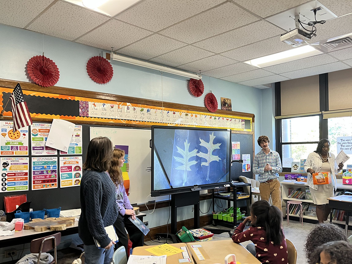 College students teach in an elementary school classroom