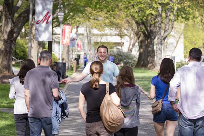 Student giving a tour of Muhlenberg College campus.