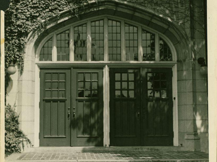 A black and white image of a set of doors on a building at Muhlenberg College.